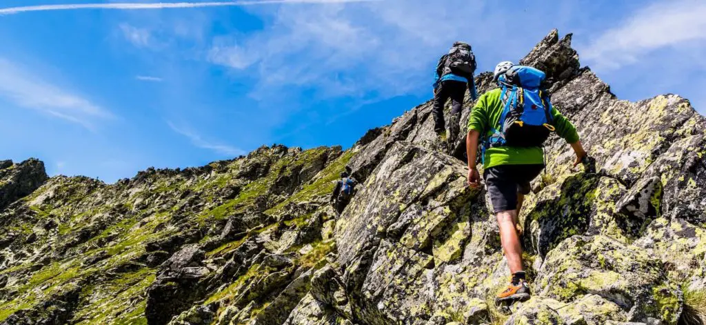 Hiking up a steep rock wall - What Does Scramble Mean in Hiking