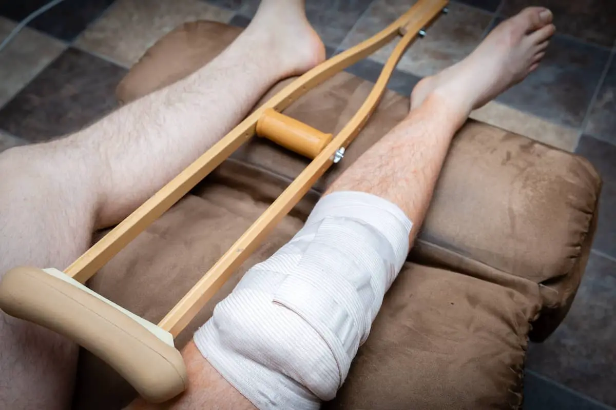 Man with his leg wrapped after knee surgery